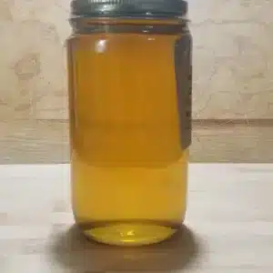organic 1lb. raw wildflower honey in round glass jar